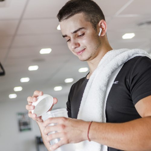 The man in the gym with the supplements